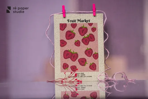 A large printed tag with a strawberry “Fruit Market” pattern